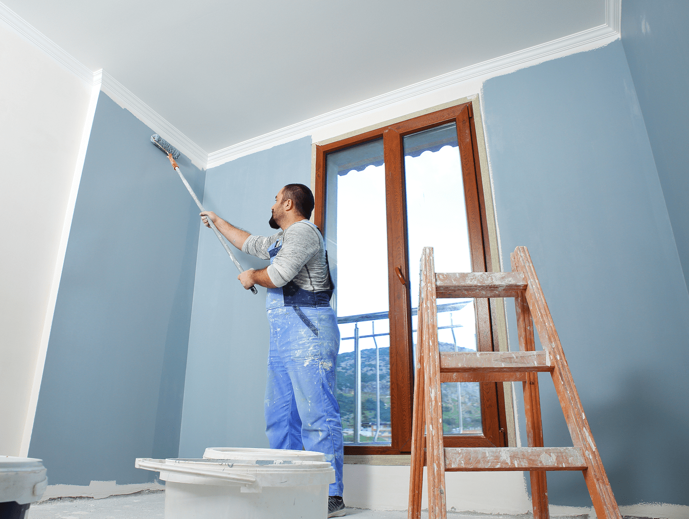 Home interior painting with ladder