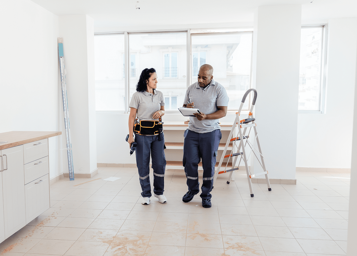 Two people evaluating interior space